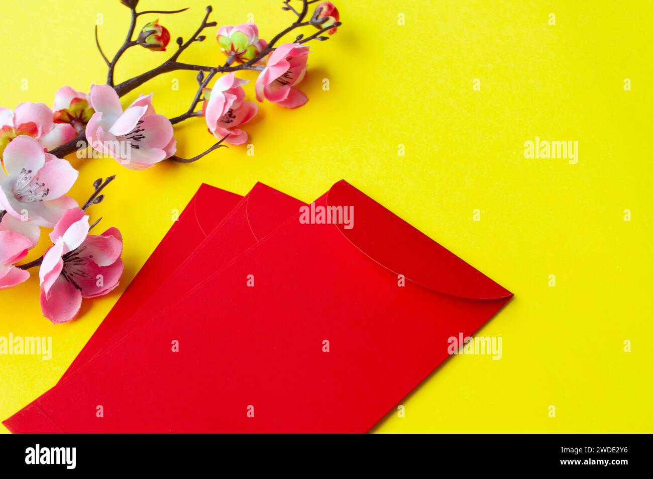 Chinese New Year red packet with customizable space for text or wishes. Chinese New Year celebration concept. Stock Photo