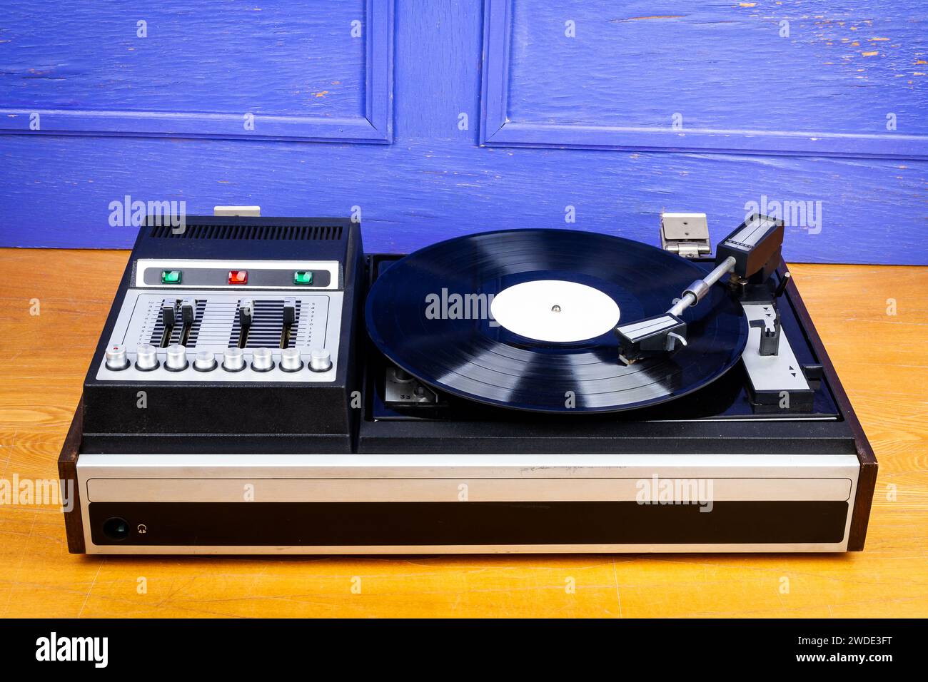 Vintage turntable vinyl record player with black vinyl on a table Stock ...