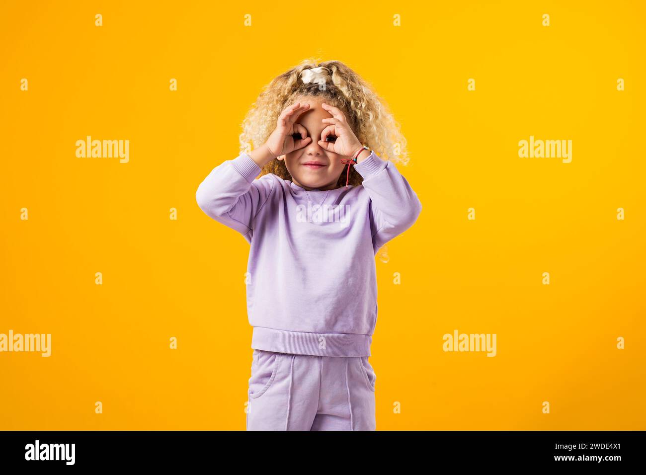 Portrait of Stressed child girl holding her head. Negative emotions concept Stock Photo