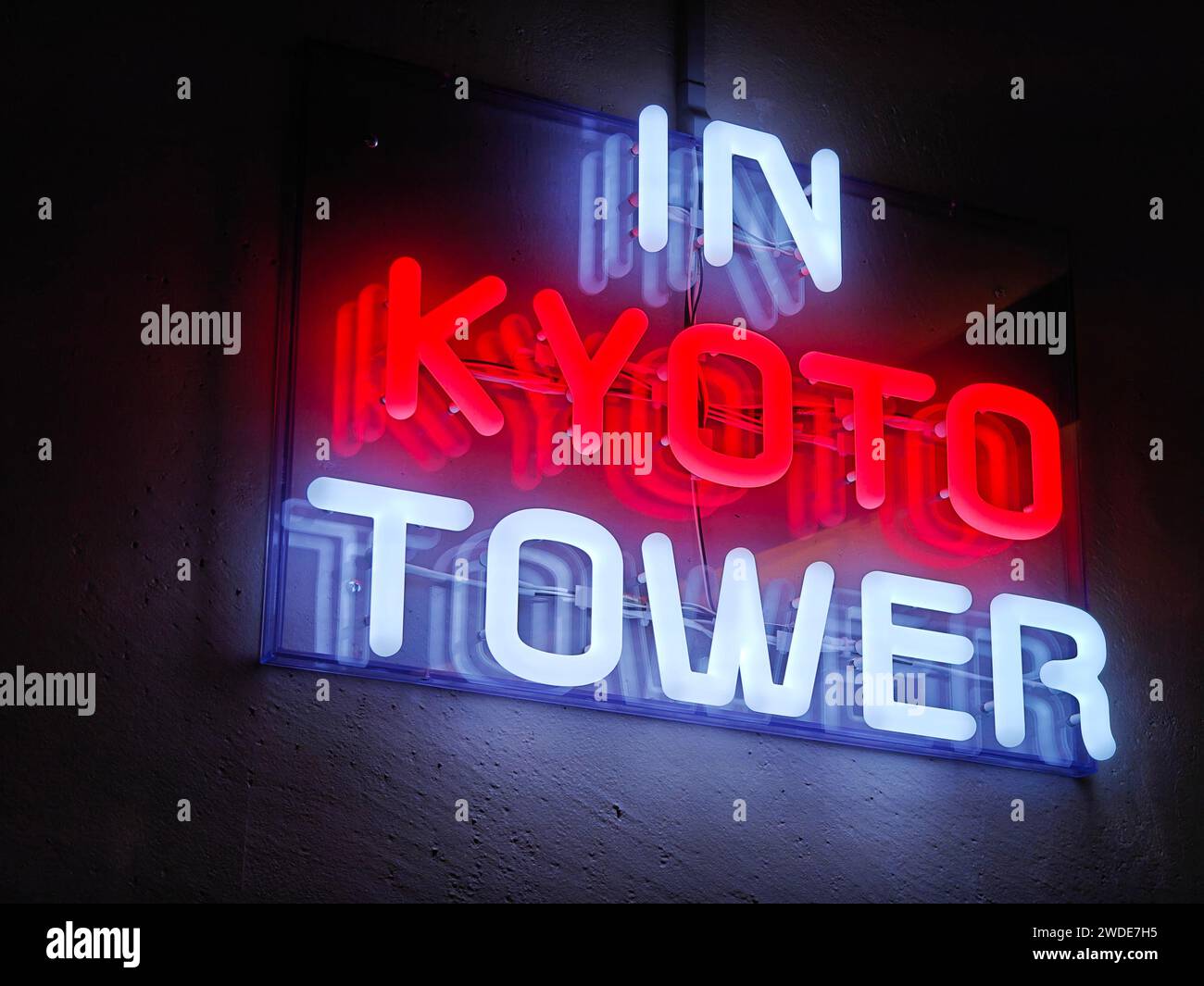 A red and white neon sign saying 'In Kyoto Tower',  Kyoto, Japan Stock Photo