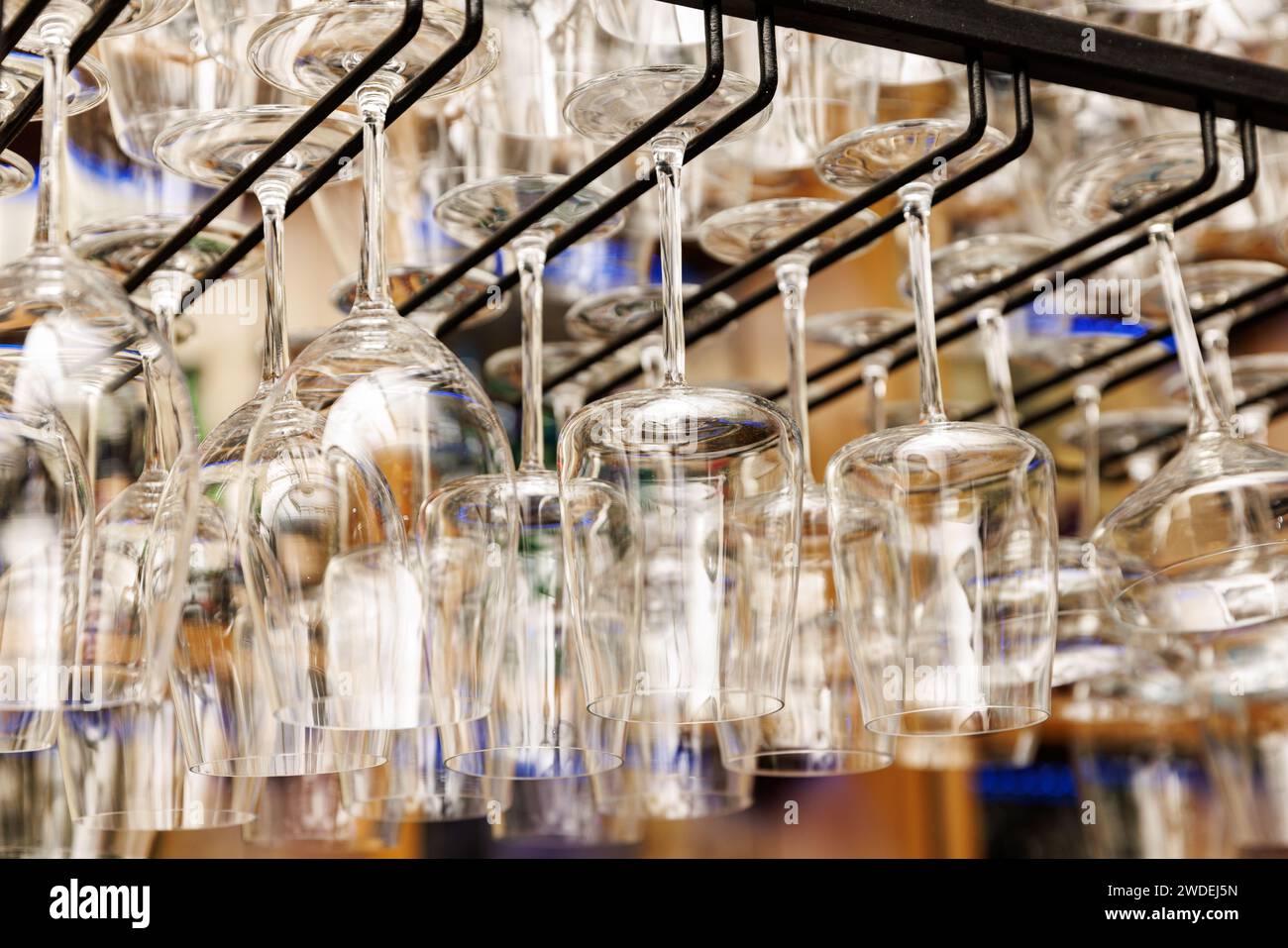 Empty glass clean upside-down stemware in nightclub or a restaurant ...