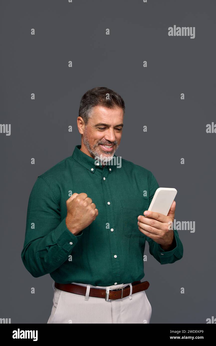 Happy man celebrating success using hi-res stock photography and images ...