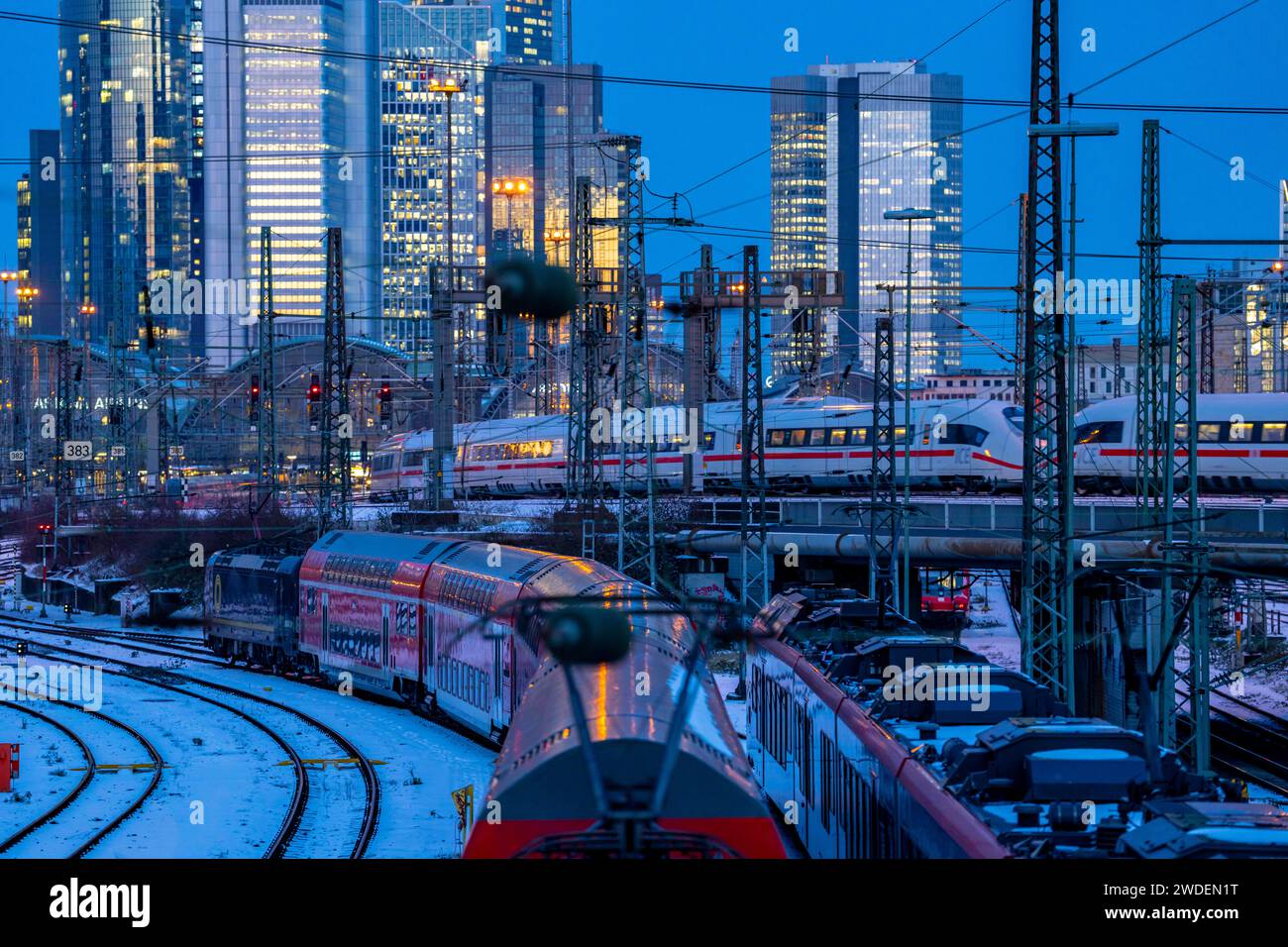 Railway tracks in front of the main station of Frankfurt am Main, ICE train, skyline of skyscrapers in the Cit, winter, snow, dusk, Hesse, NRW, Stock Photo