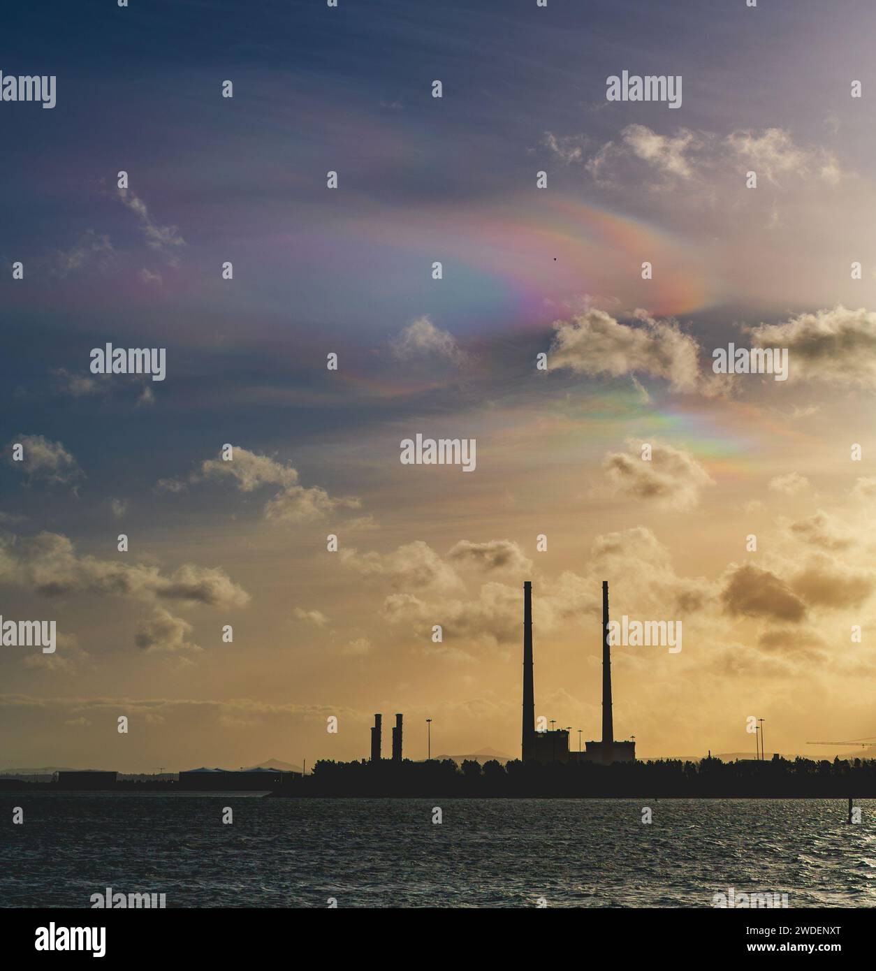 Very rare type-3 nacreous or polar stratospheric clouds above the Poolbeg Chimneys from Clontarf seafront on a windy December day Stock Photo