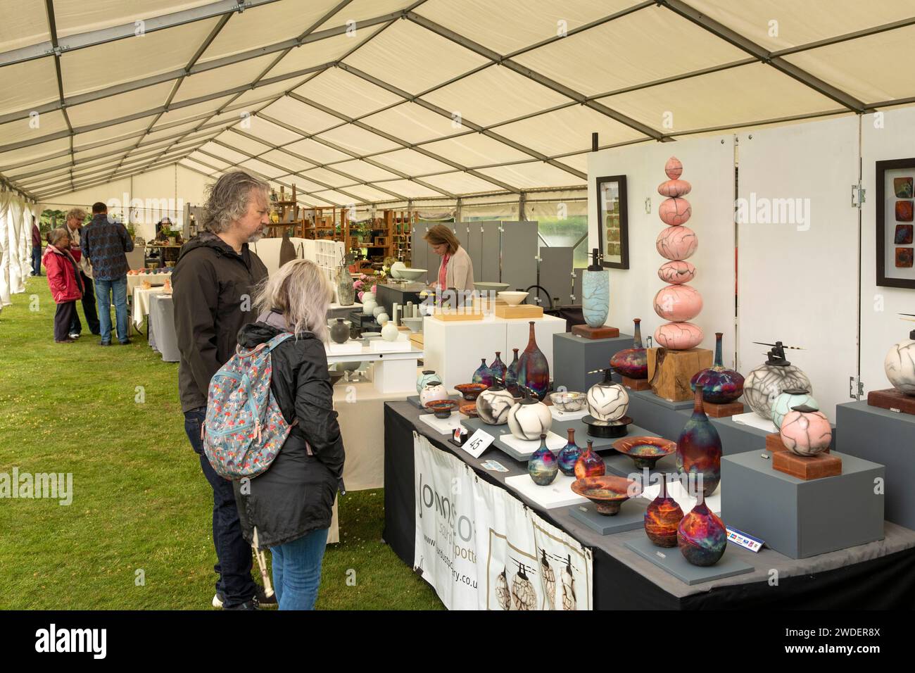 UK, England, Warwickshire, Compton Verney House, Potfest ceramics event, visitors in marquee Stock Photo