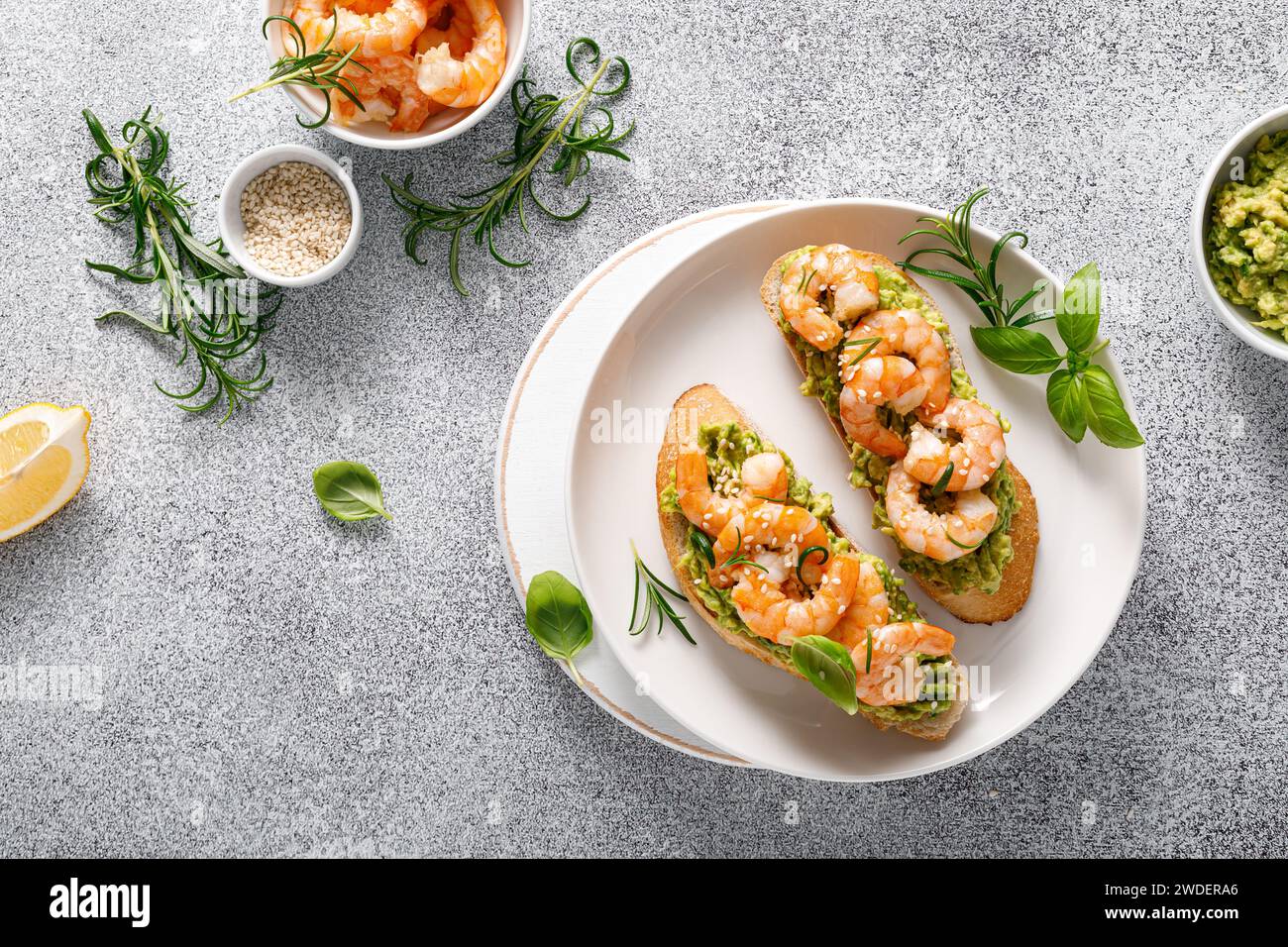 Shrimp and avocado sandwich with baguette and sesame. Top view Stock Photo