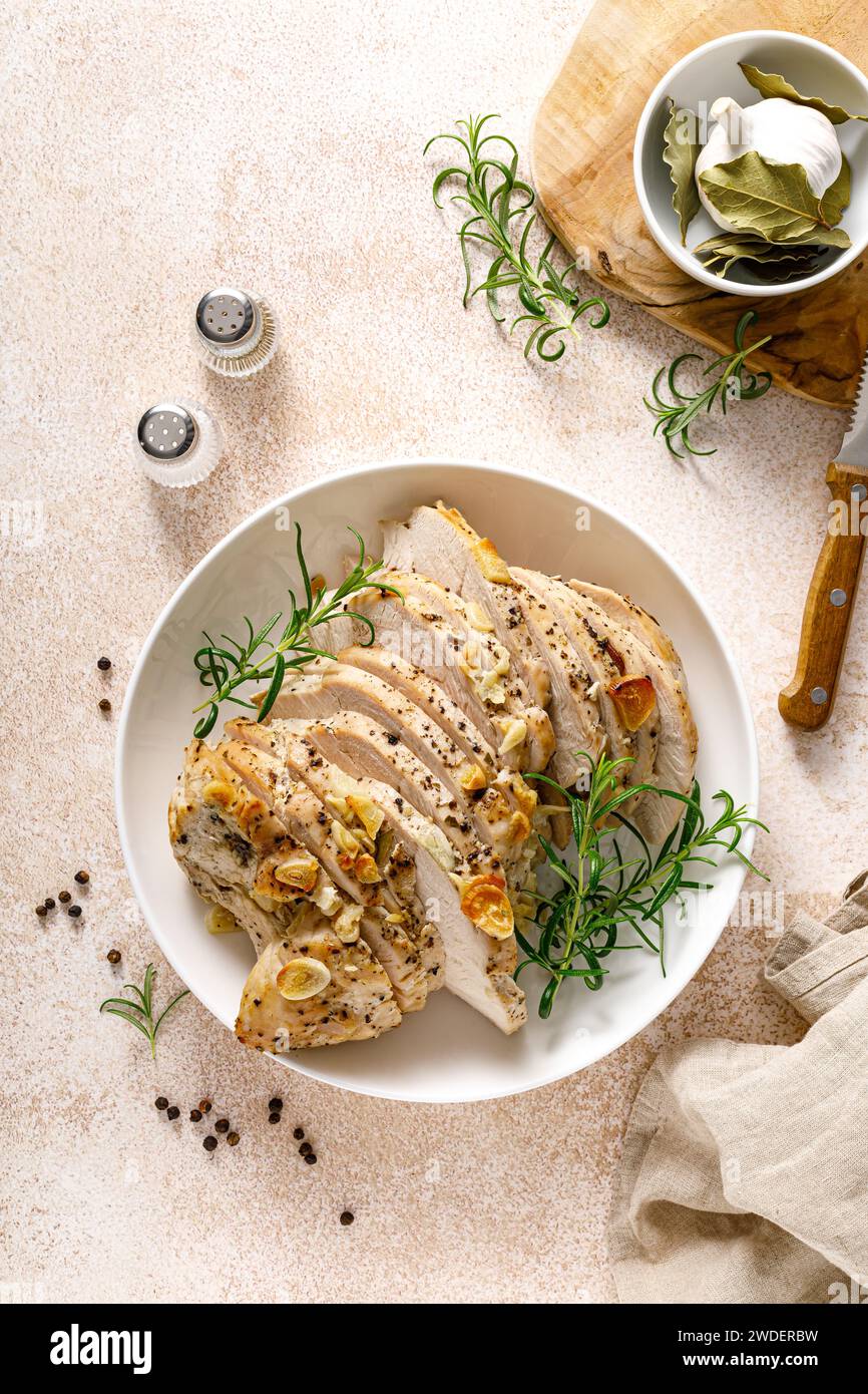 Turkey meat fillet baked with garlic, rosemary and spices. Top view Stock Photo