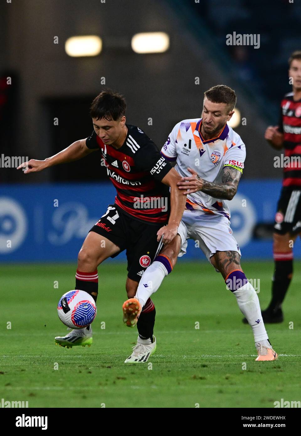 Parramatta, Australia. 20th Jan, 2024. Aidan Simmons (L) of Western Sydney Wanderers FC and Adam Jake Taggart (R) of Perth Glory FC are seen in action during the Isuzu UTE Men's A-League 2023/24 season round 13 match between Western Sydney Wanderers FC and Perth Glory FC held at the CommBank Stadium. Final score; Western Sydney Wanderers 1:2 Perth Glory FC. Credit: SOPA Images Limited/Alamy Live News Stock Photo