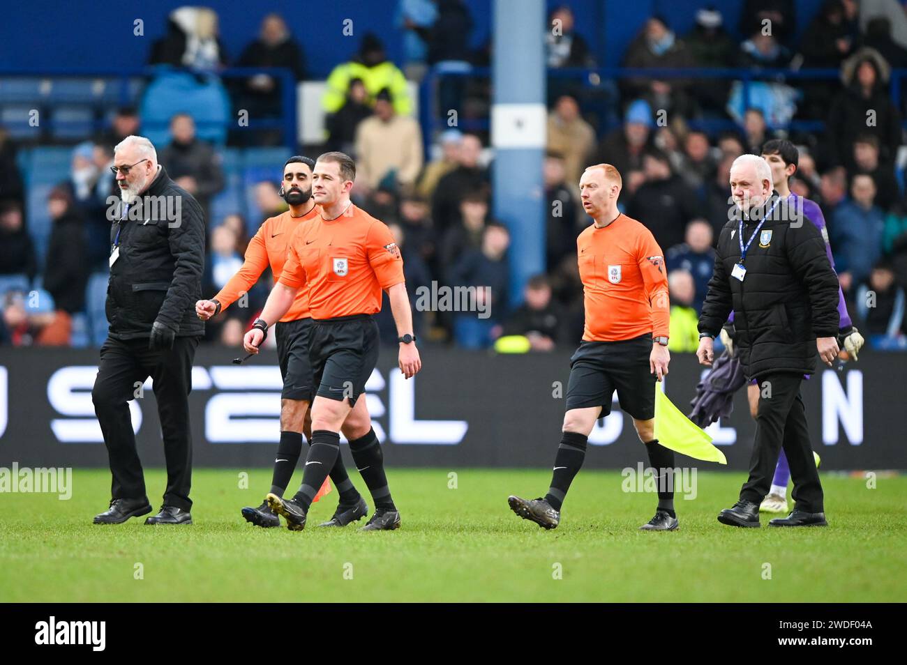 Referee Anthony Backhose, Assistant Referee Bhupinder Singh Gill  and Assistant Referee Carl Fitch-Jackson are booed from the field at half time during the Sky Bet Championship match Sheffield Wednesday vs Coventry City at Hillsborough, Sheffield, United Kingdom, 20th January 2024 (Photo by Craig Cresswell/News Images) Stock Photo