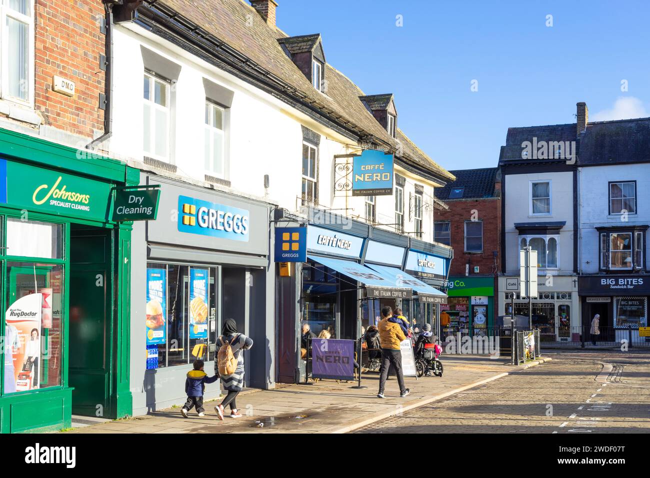 Ripon Market Place North Greggs bakery and Caffe Nero coffee shop with other local Shops in Ripon North Yorkshire England UK GB Europe Stock Photo