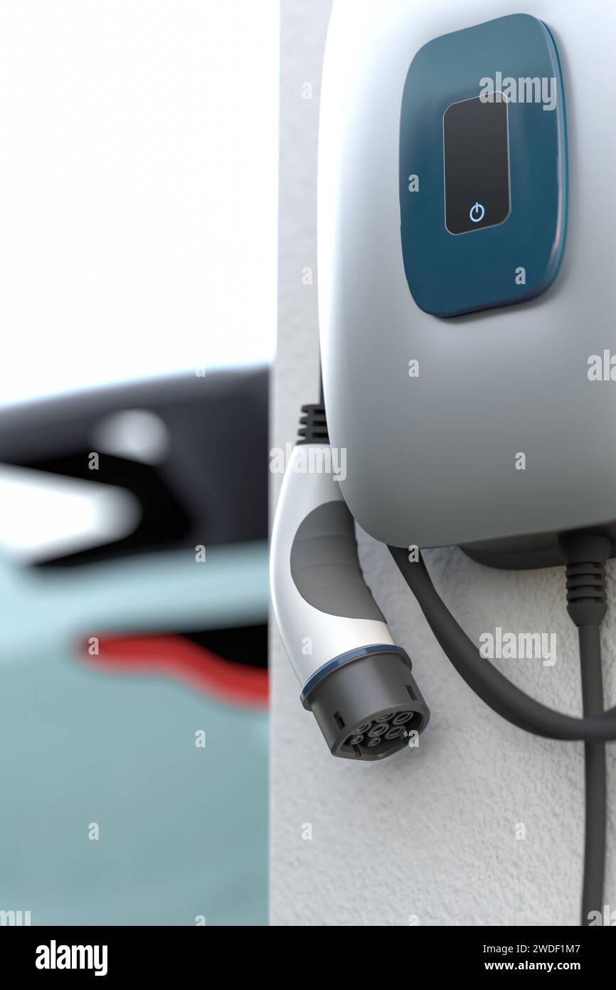 Electric vehicle charging station (wallbox) with European Type 2  IEC 62196 Plug hanging on a garage wall. Out of focus car in the background. Stock Photo