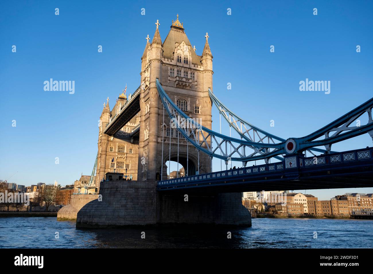 View of Tower Bridge in early evening light on 16th January 2024 in London, United Kingdom. Tower Bridge is a Grade I listed combined bascule and suspension bridge in London, built between 1886 and 1894, designed by Horace Jones and engineered by John Wolfe Barry with the help of Henry Marc Brunel. Stock Photo