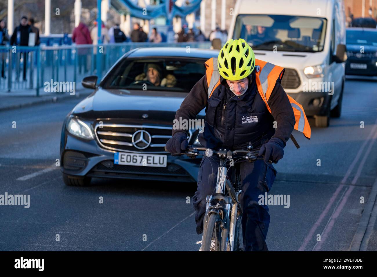 Cyclists cycling across Tower Bridge on 16th January 2024 in London, United Kingdom. Cycling is a very popular mode of transport in the capital as people try to avoid public transport, saving money, getting fit and saving time. Stock Photo
