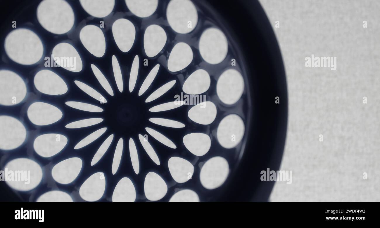 Round perforated pattern similar to the design of an aircraft turbine Stock Photo