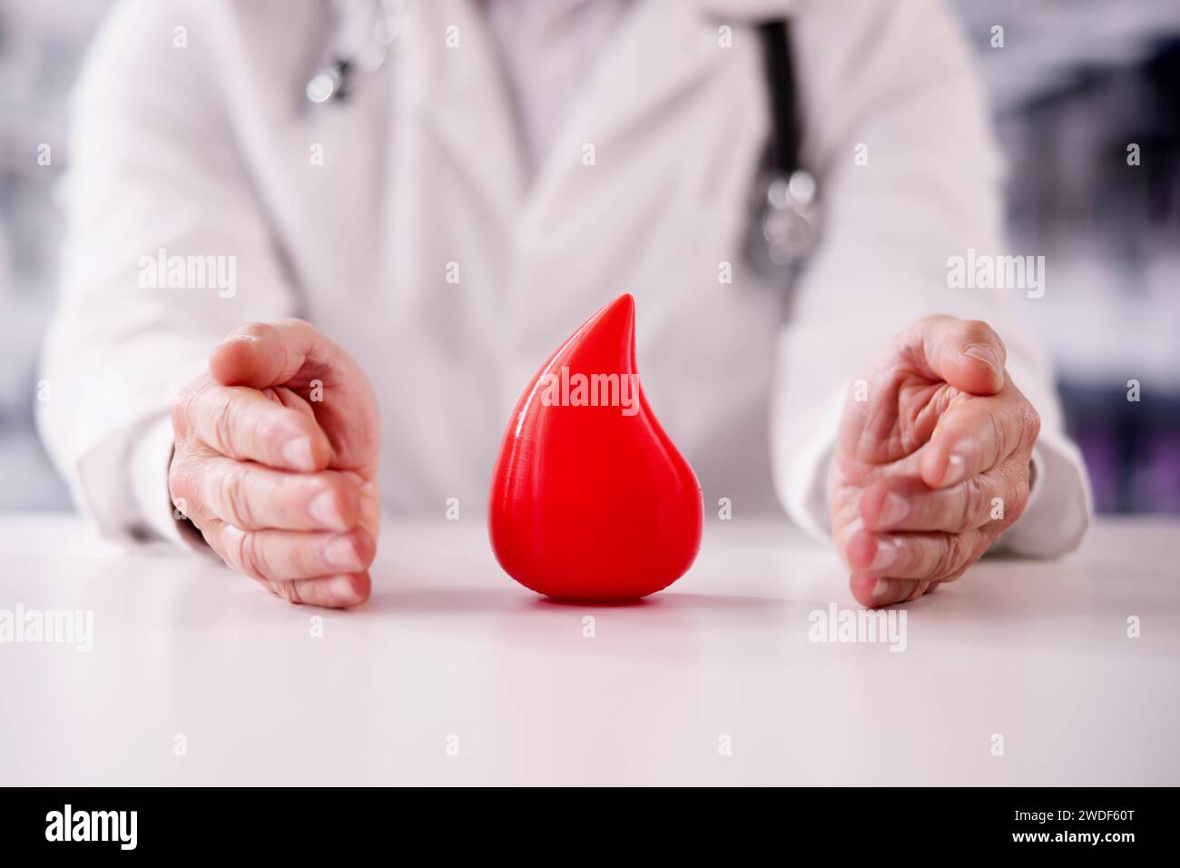 Hemophilia World Day. Doctor With Donor Blood Drop Stock Photo