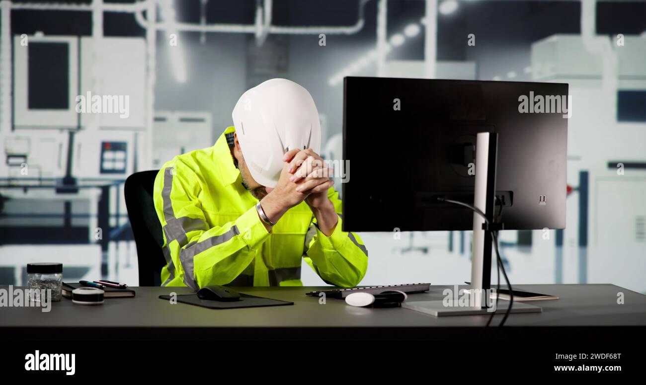 Shocked Engineer In Automated Semiconductor Factory During Ransomware Attack Stock Photo