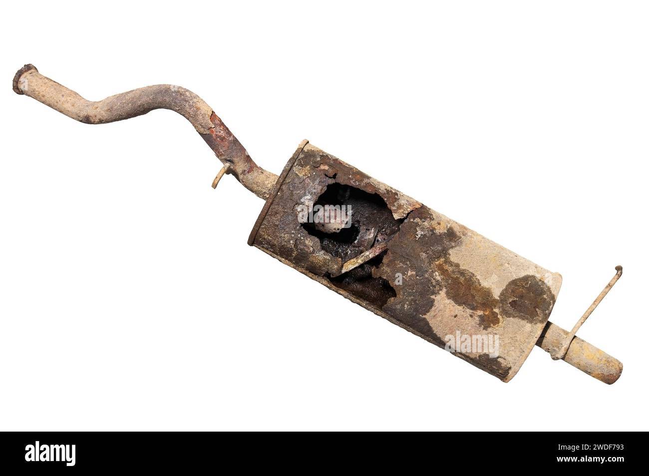 Old car muffler with a hole in the exhaust can and rust on a white