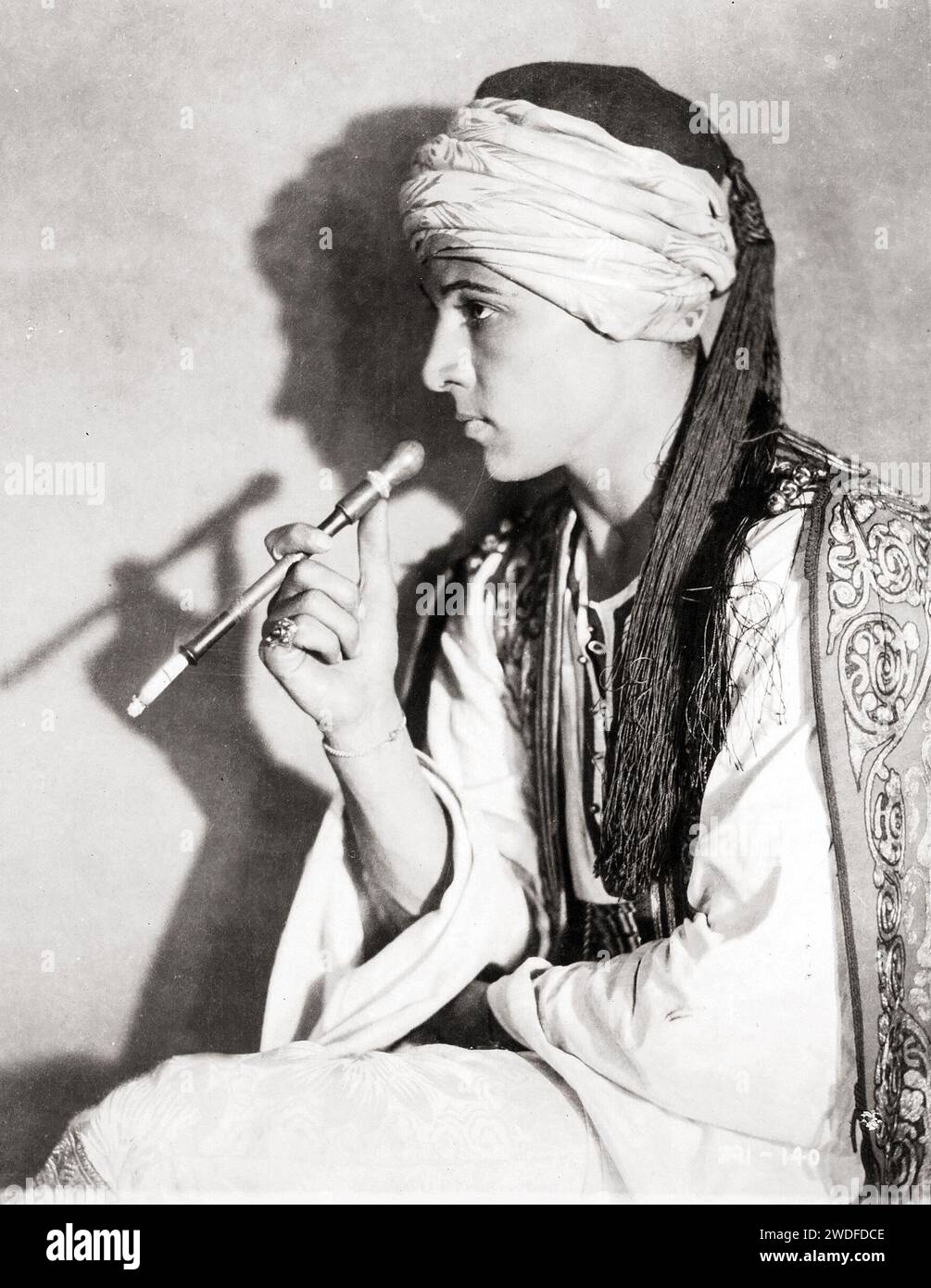 Rudolph Valentino in The Sheik - smoking and with turban, 1921 Stock Photo