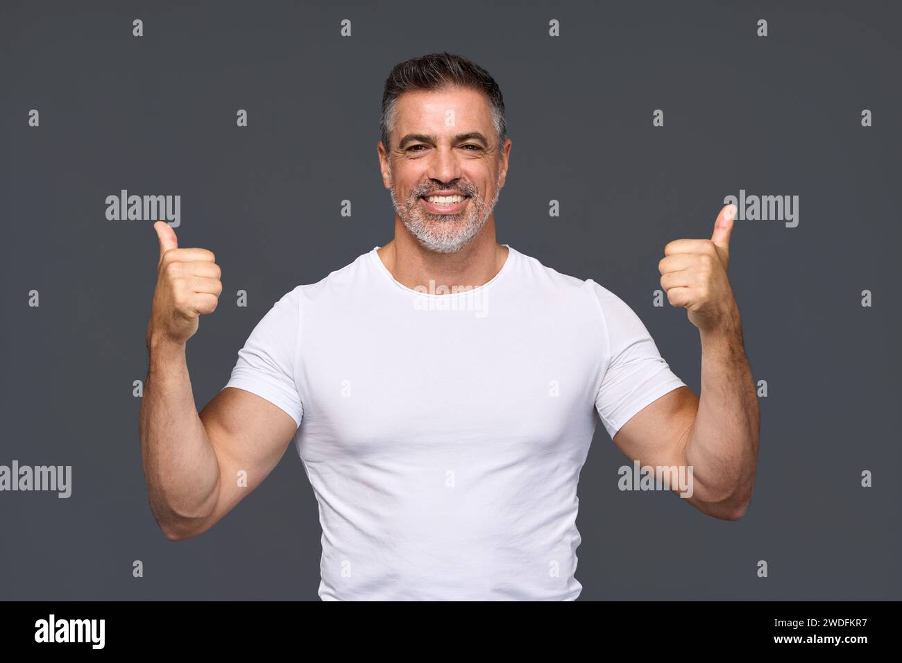 Happy fit sporty older man personal trainer showing thumbs up isolated ...