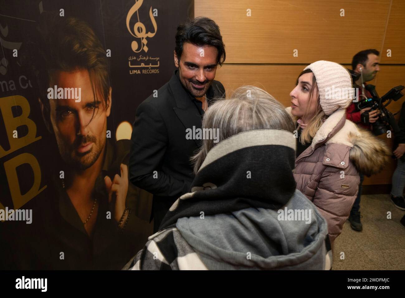 Tehran, Iran. 20th Jan, 2024. Iranian singer and composer Sohrab Pakzad is speaking with his fans after performing in a concert at the Tehran Milad Tower Cultural and Recreational Complex in Tehran, Iran, on January 19, 2024. The concert is being planned and performed by the Lima Records Cultural and Artistic Institute. (Photo by Morteza Nikoubazl/NurPhoto) Credit: NurPhoto SRL/Alamy Live News Stock Photo