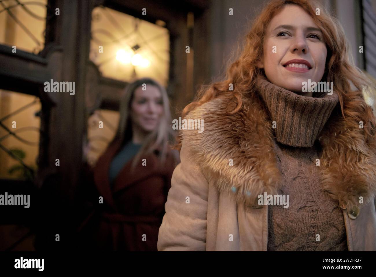 woman in foreground and woman in background out of photo in the city Stock Photo