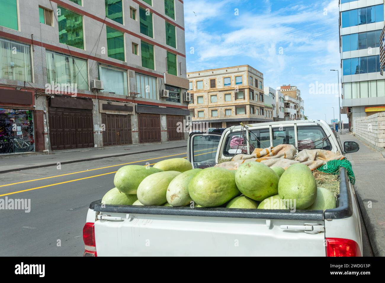 Pickup car full of watermelons on the street of Jeddah downtown central district, Saudi Arabia Stock Photo