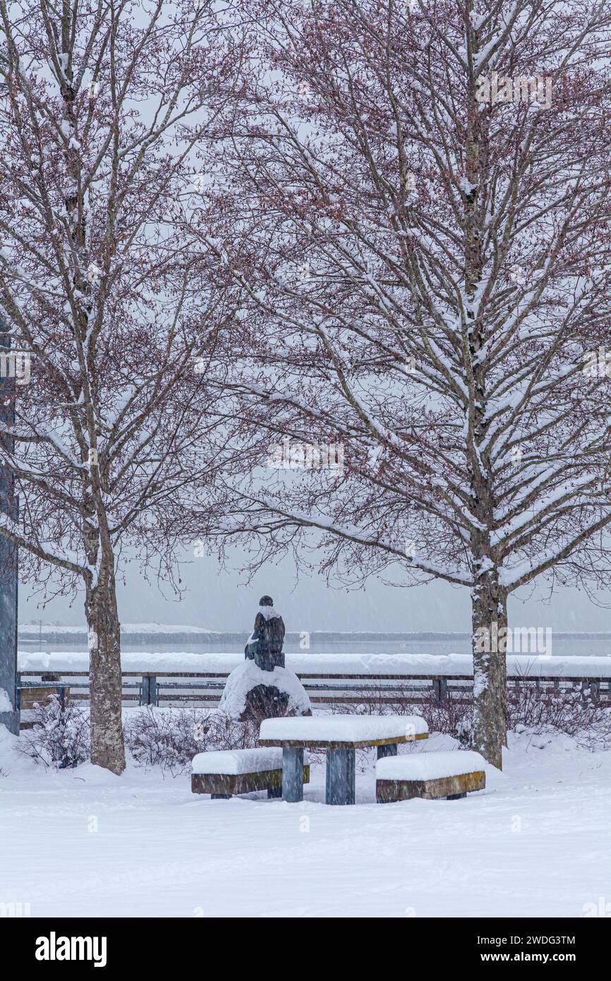 Snow-draped fishermans statue along the Steveston Waterfront in British Columbia Canada Stock Photo