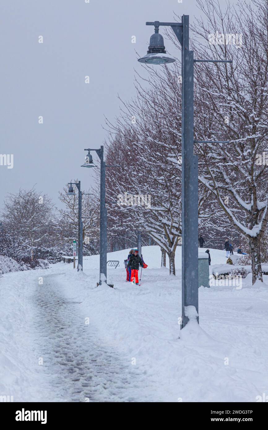 Young family cross country skiing in Steveston British Columbia Canada Stock Photo