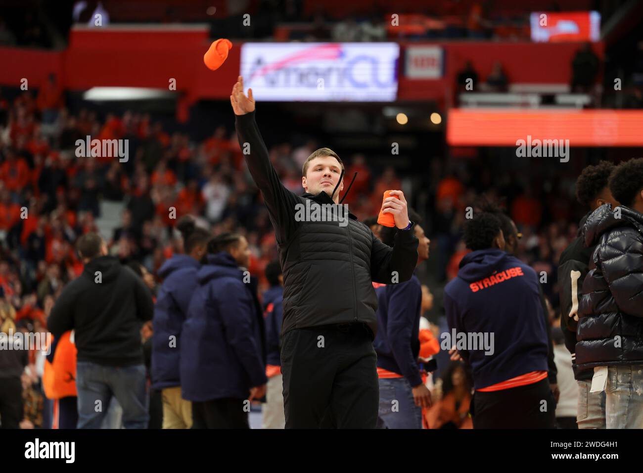 Syracuse, New York, USA. 20th Jan, 2024. During the ACC conference basketball game between Syracuse University and Miami University, newly signed Syracuse quarterback KYLE MCCORD throws out t-shirts to the crowd during the first half of the game held at the JMA Wireless Dome on the campus of Syracuse University. (Credit Image: © Scott Rausenberger/ZUMA Press Wire) EDITORIAL USAGE ONLY! Not for Commercial USAGE! Stock Photo