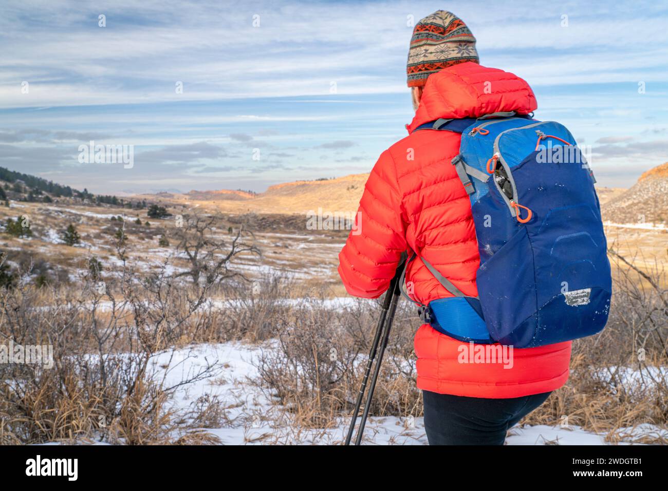 male backpacker in winter landscape of Colorado foothills - Horsetooth Mountain Open Space and Lory State Park Stock Photo