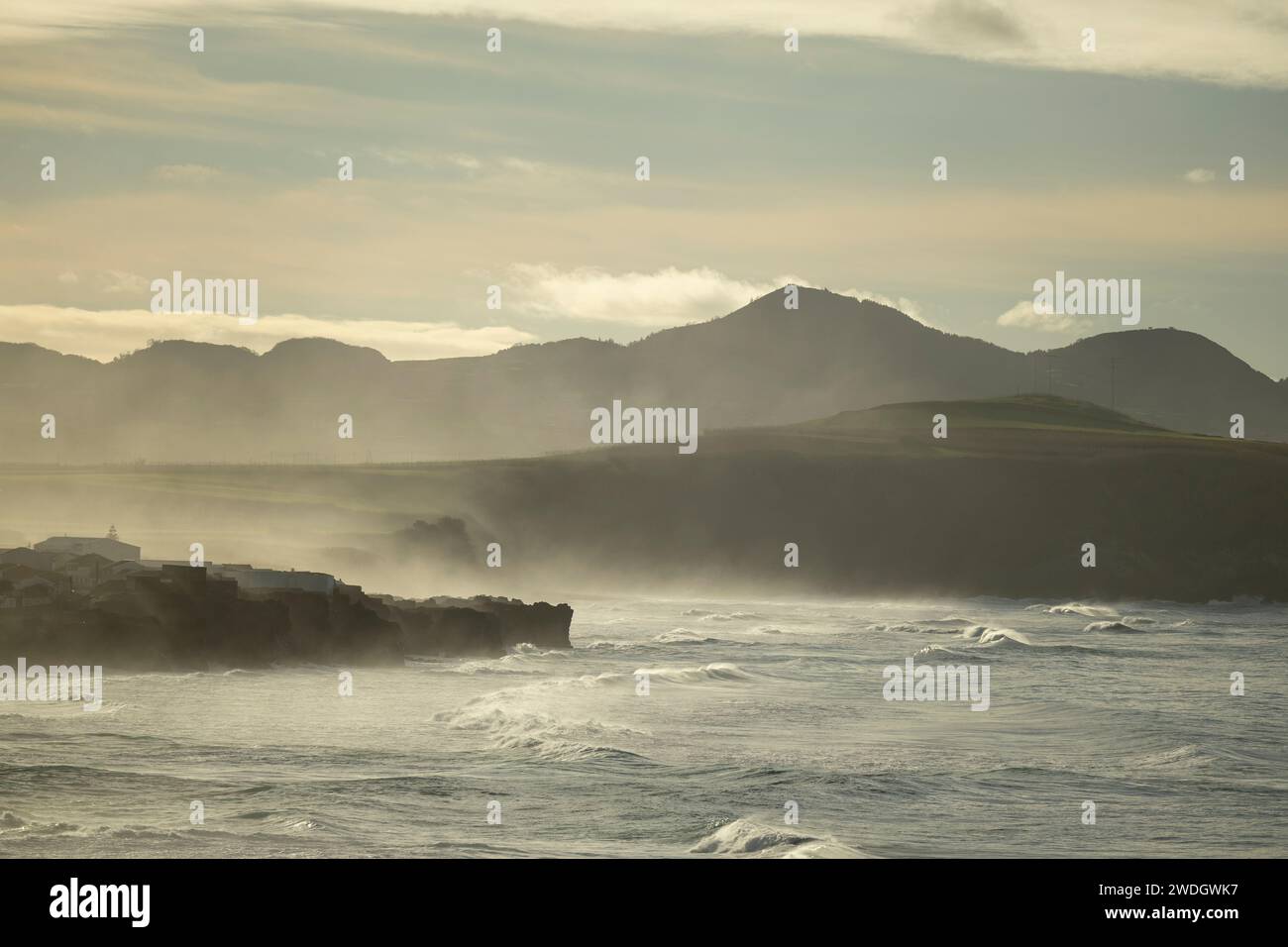 Waves breaking on the north coast of the island of São Miguel in the afternoon, with a lot of fog from the Atlantic Ocean. Sao Miguel Island, Azores Stock Photo