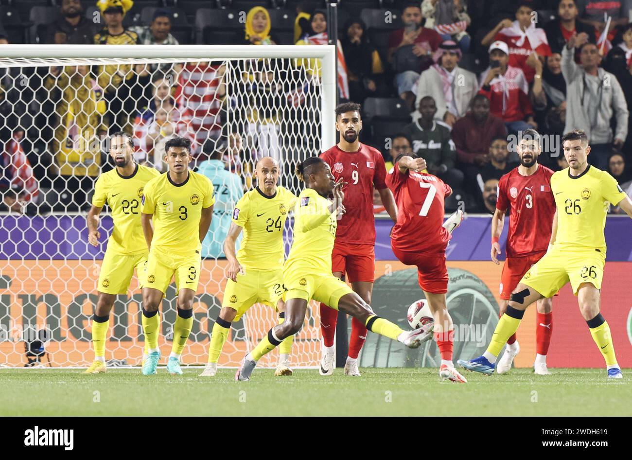 Doha, Qatar. 20th Jan, 2024. Ali Madan (3rd R) of Bahrain shoots to ...