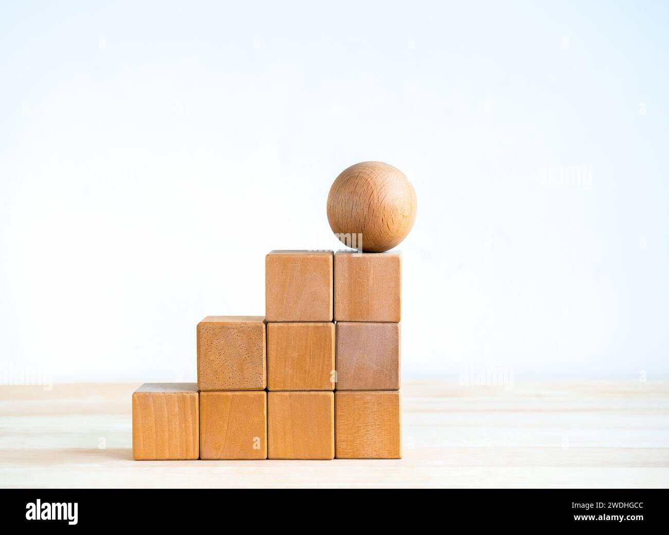 Empty blank wooden cube blocks build as a steps with the sphere one on ...