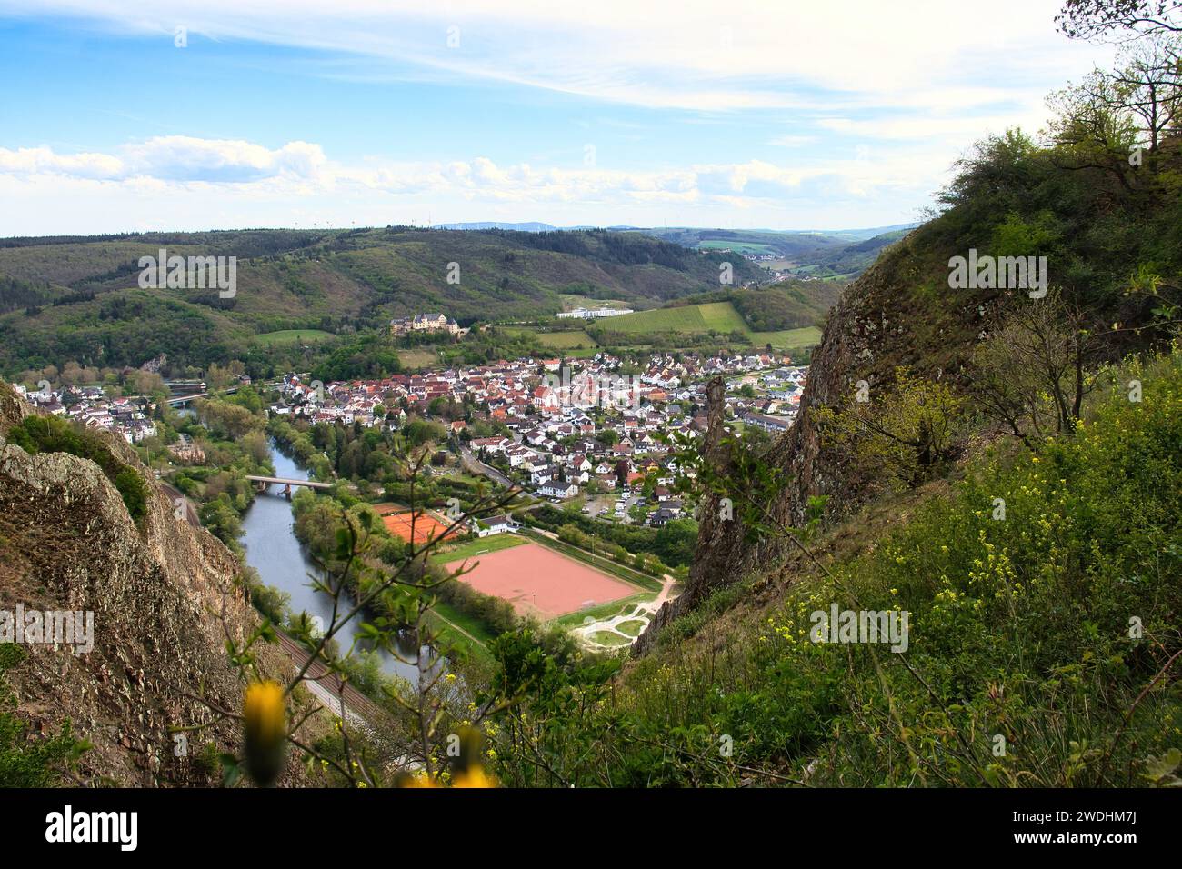 Bad Munster, Germany - May 9, 2021: Aerial view from the top of Rotenfels overlooking Bad Munster with Ebernburg castle in the distance on a spring da Stock Photo