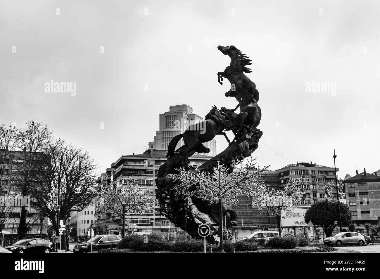VIGO, SPAIN-December,30,2021: Sculptural group in black bronze forms a kind of ascending metallic spiral that reaches 18 meters in height Stock Photo