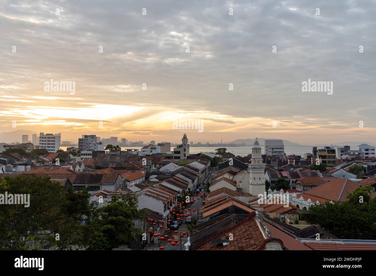 Penang, Malaysia. 17th Jan, 2024. Aerial view at sunrise time of George Town City, Penang Island. George Town, the capital of the Malaysian island of Penang is known for its British colonial buildings, Chinese shophouses, and mosques. Beyond the old town, George Town is a modern city with skyscrapers and shopping malls. Credit: SOPA Images Limited/Alamy Live News Stock Photo