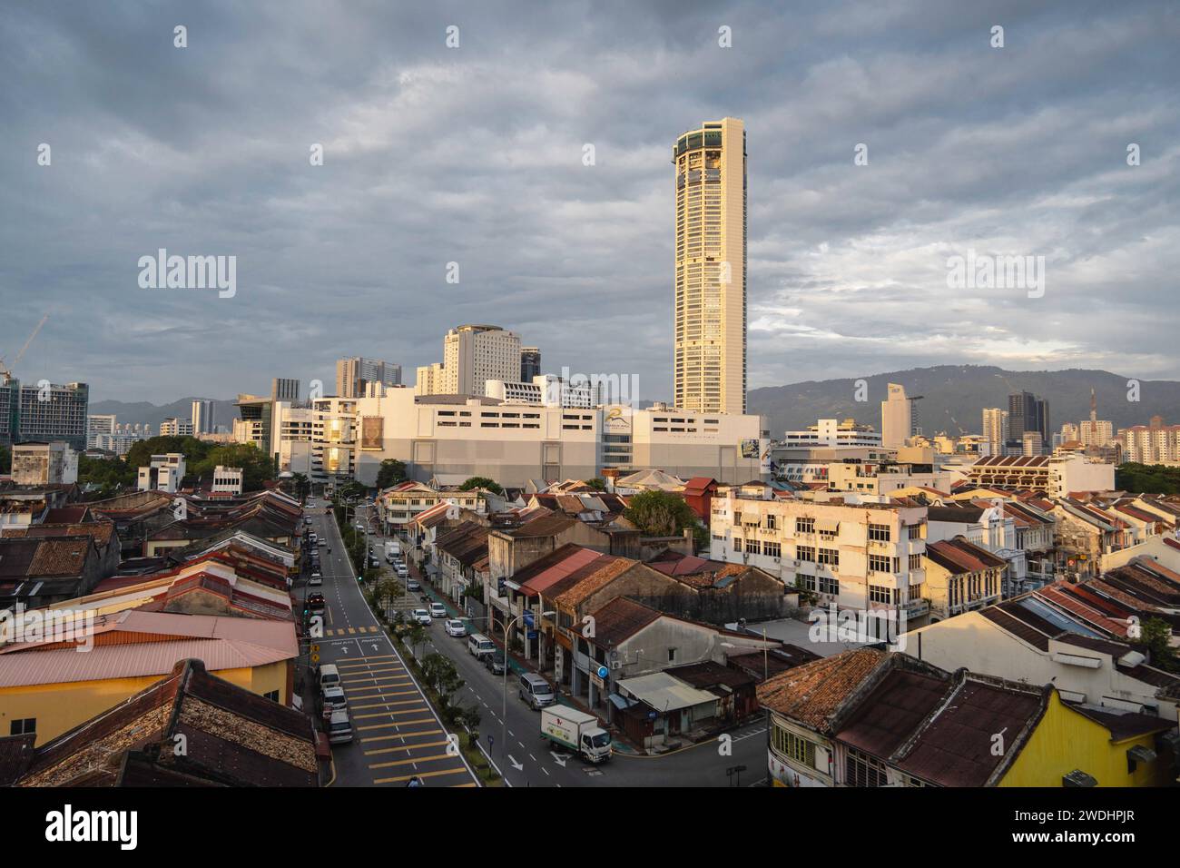 Penang, Malaysia. 17th Jan, 2024. Aerial view of George Town City with traditional houses, skyscrapers, and shopping mall, Penang Island. George Town, the capital of the Malaysian island of Penang is known for its British colonial buildings, Chinese shophouses, and mosques. Beyond the old town, George Town is a modern city with skyscrapers and shopping malls. Credit: SOPA Images Limited/Alamy Live News Stock Photo