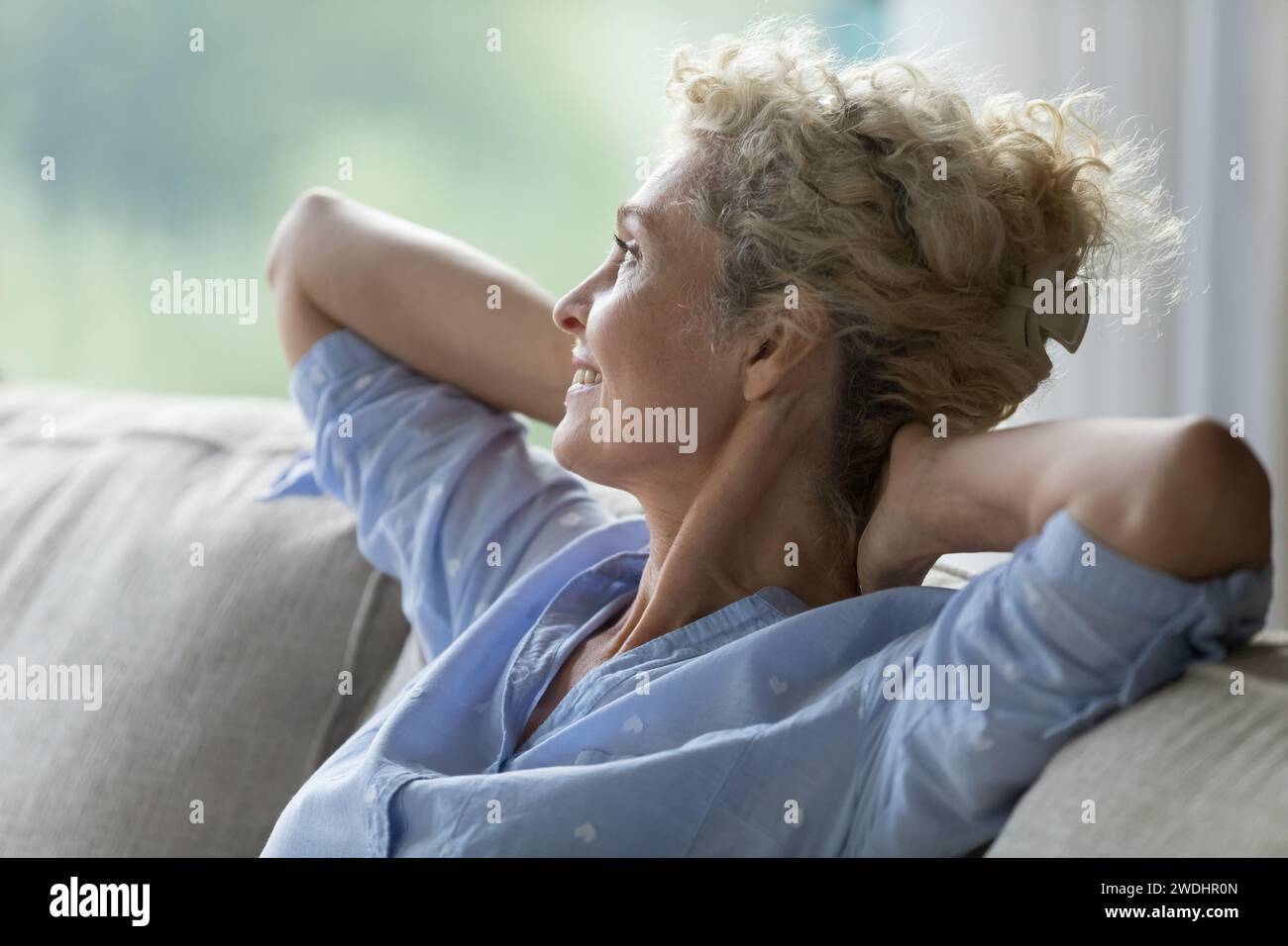 Close up side view mature peaceful woman relaxing on sofa Stock Photo ...