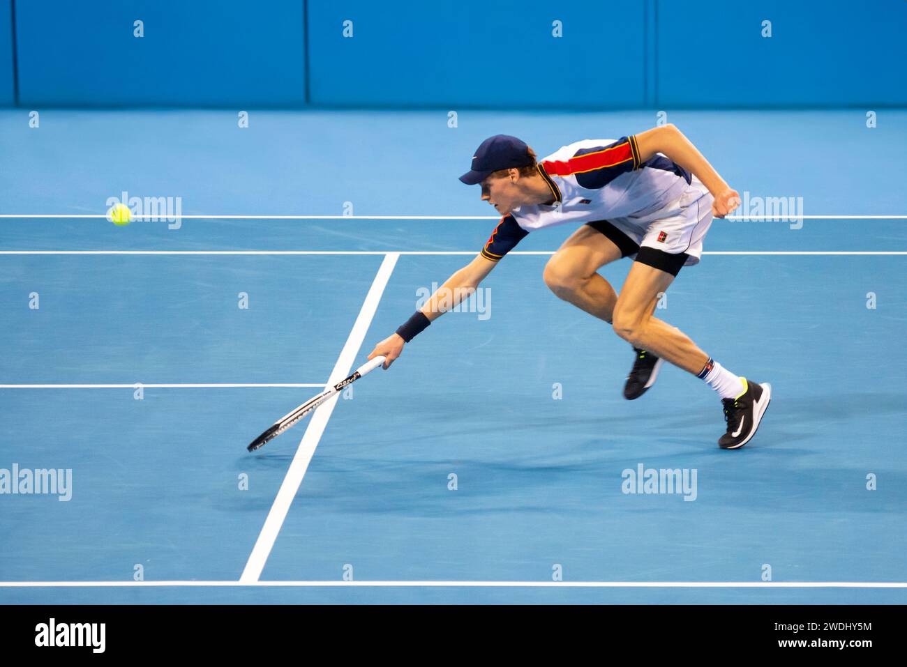 Jannik Sinner isolated playing in action during the final of the Sofia Open 2021 ATP 250 indoor tennis tournament on hard courts. Stock Photo