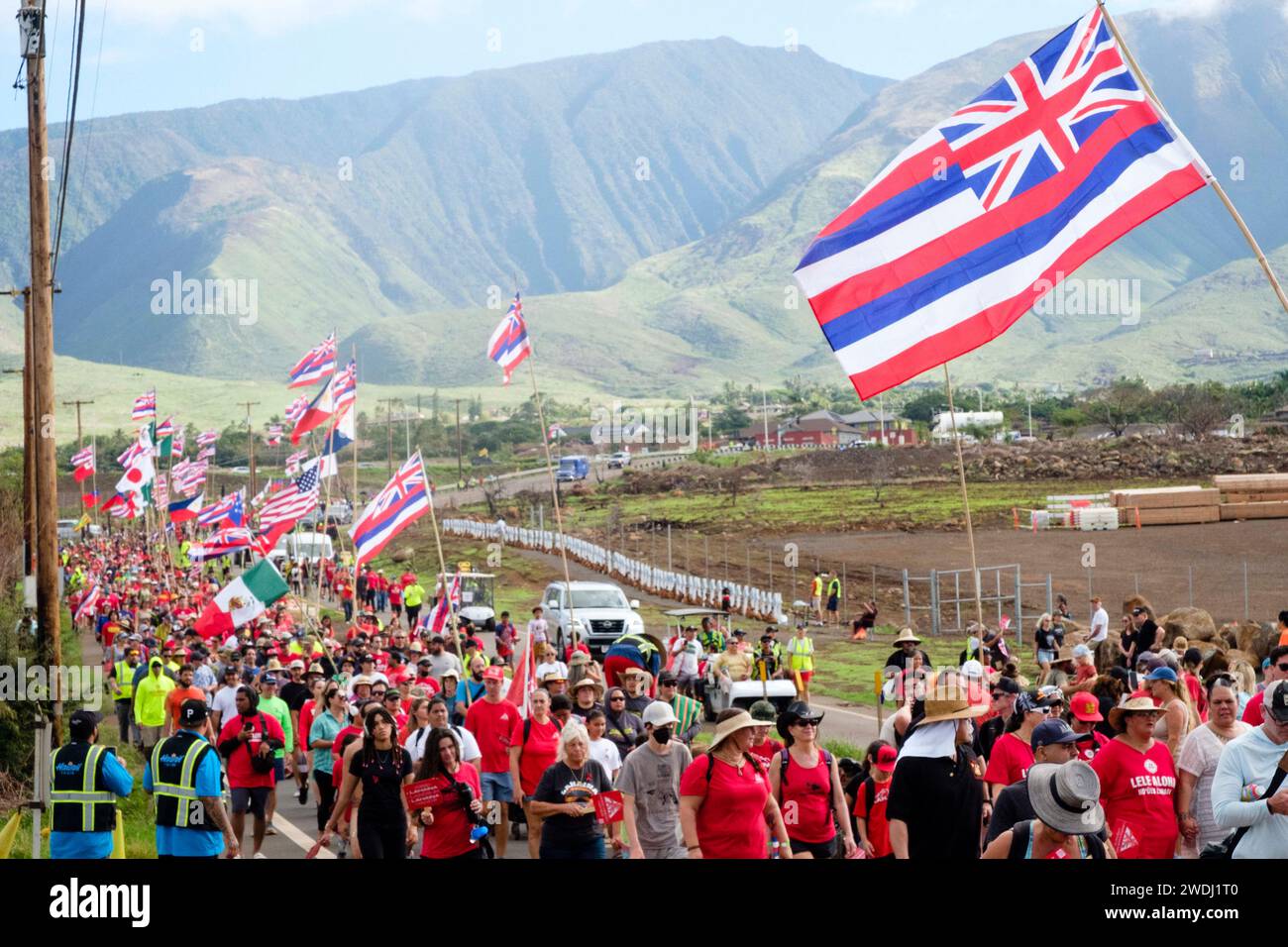 Lahiana, Hawaii, USA. 20th Jan, 2024. Local Maui residents march in the Houlu Lahaina Unity