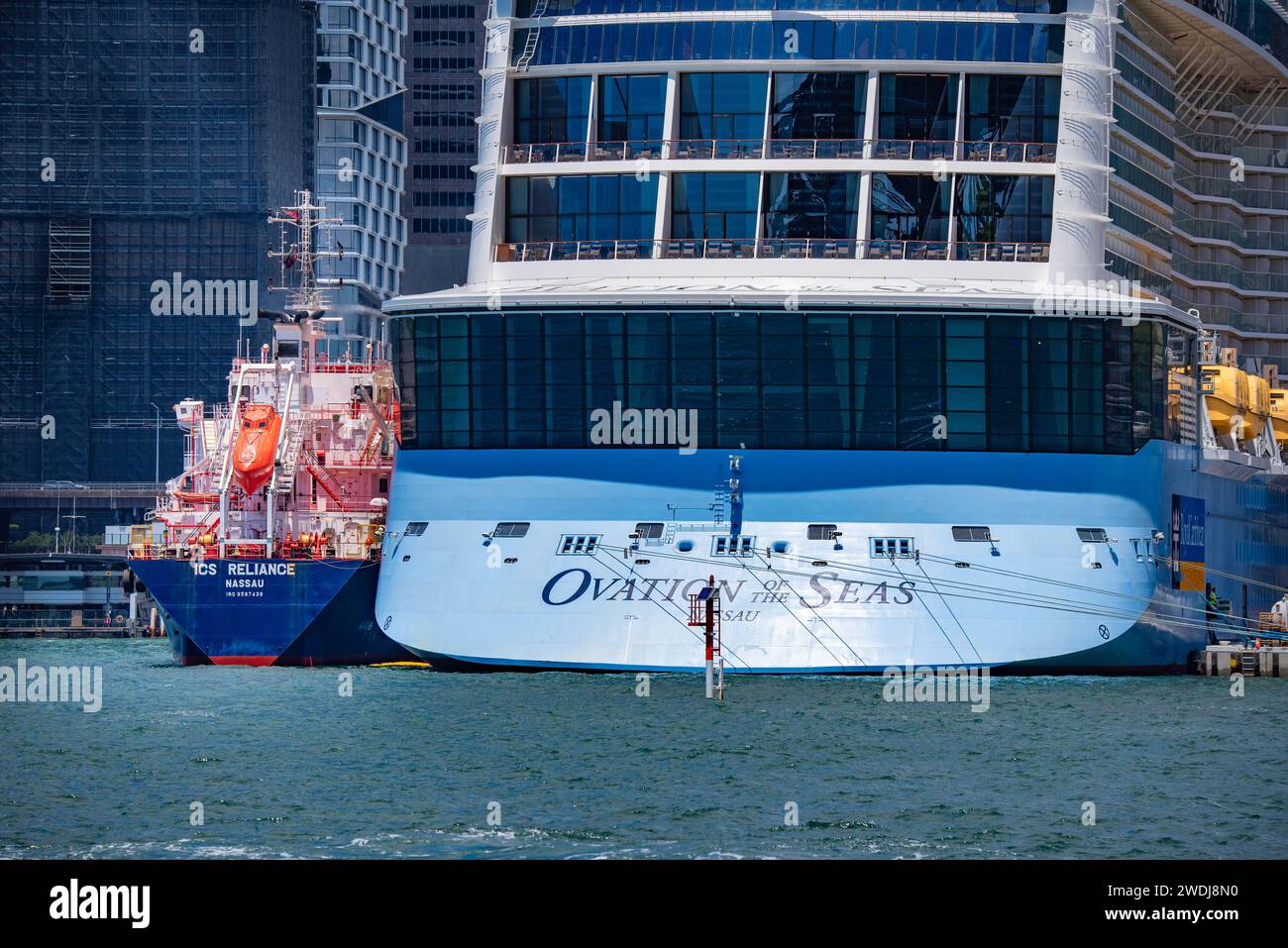 ICS RELIANCE refueling Cruise Ship Ovation of the Seas at the Overseas Passenger Terminal, is a 2011 built Oil Products Tanker or bunker ship Stock Photo