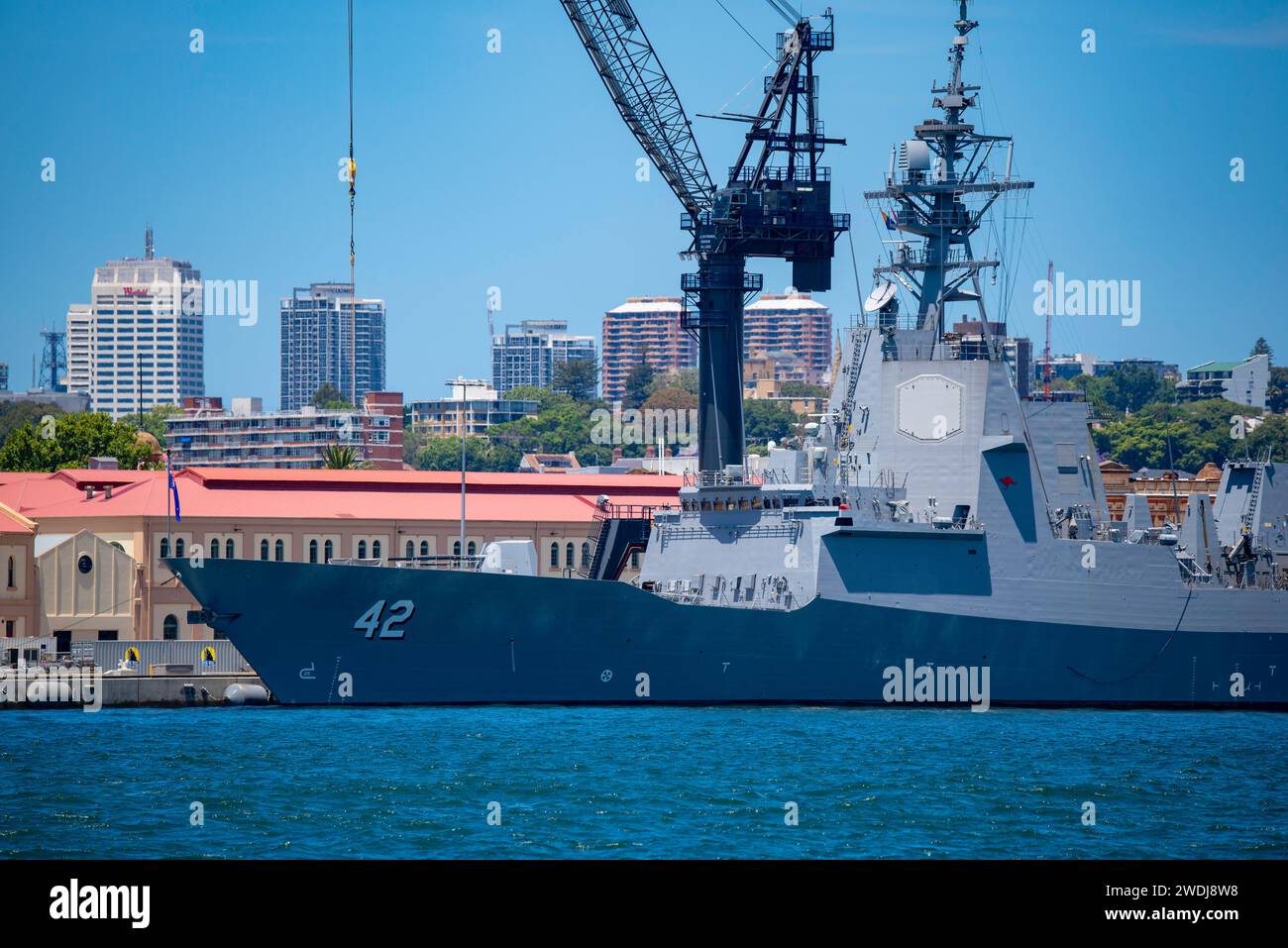 Australian navy ship HMAS Sydney (DDG 42) a Hobart Class Air Warfare Destroyer moored alongside its sister ship HMAS Hobart at Garden Island in Sydney Stock Photo