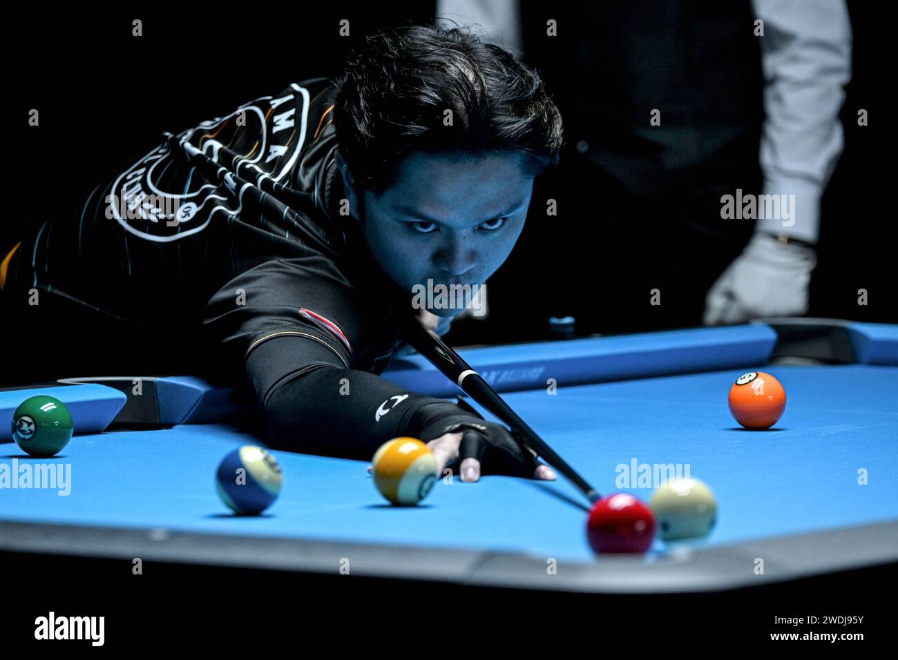 Jakarta, Indonesia. 21st Jan, 2024. Darryl Chia Son Yew of Malaysia competes during the qualification match between Oliver Szolnoki of Hungary and Darryl Chia Son Yew of Malaysia at the 10-Ball Indonesia International Open 2024 in Jakarta, Indonesia, Jan. 21, 2024. Credit: Agung Kuncahya B./Xinhua/Alamy Live News Stock Photo