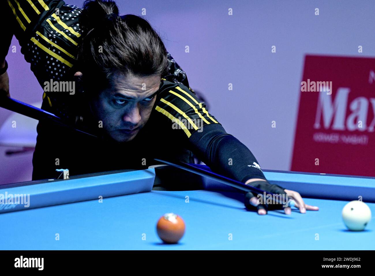 Jakarta, Indonesia. 21st Jan, 2024. Arie Tokyo of Indonesia competes during the qualification match between Fransisco Sanchez-Ruiz of Spain and Arie Tokyo of Indonesia at the 10-Ball Indonesia International Open 2024 in Jakarta, Indonesia, Jan. 21, 2024. Credit: Agung Kuncahya B./Xinhua/Alamy Live News Stock Photo