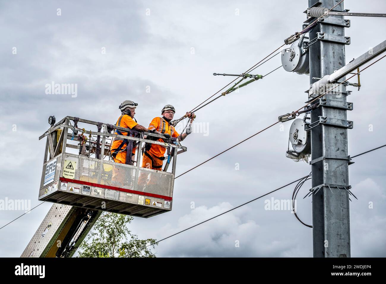 Overhead line maintenance on rail tracks Stock Photo