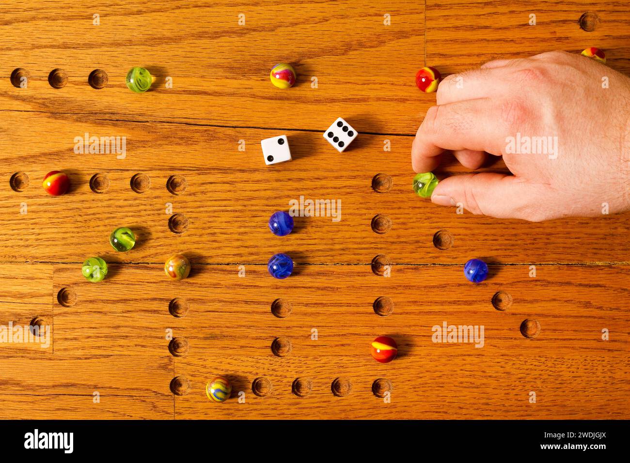 Hand with dice hi-res stock photography and images - Alamy
