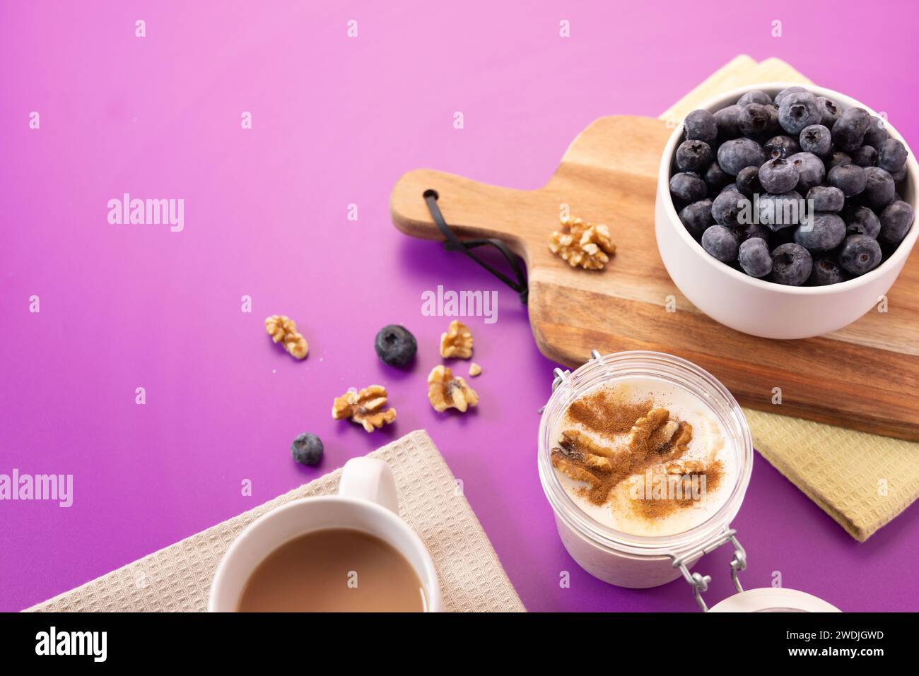Healthy food photo with porridge, blueberries, banana, cinnamon and walnuts with attrezo Stock Photo