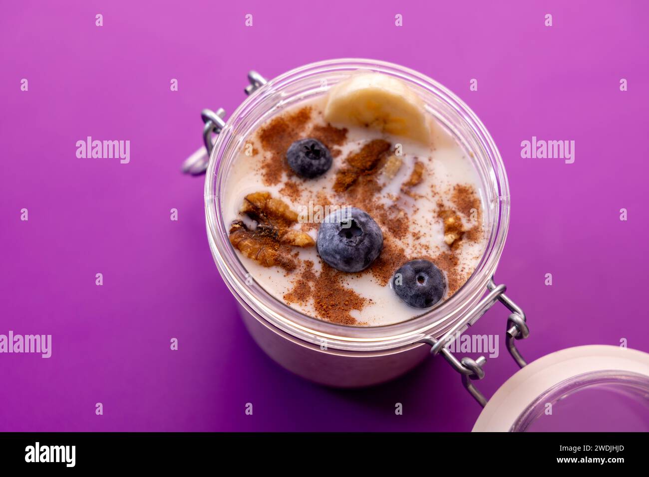 Healthy food photo with porridge, blueberries, banana, cinnamon and walnuts with attrezo Stock Photo