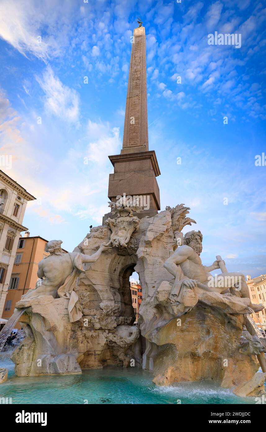 Urban view of Rome, Italy: Fountain of the Four Rivers (Fontana dei Quattro Fiumi) with an Egyptian obelisk in Navona Square (Piazza Navona). Stock Photo