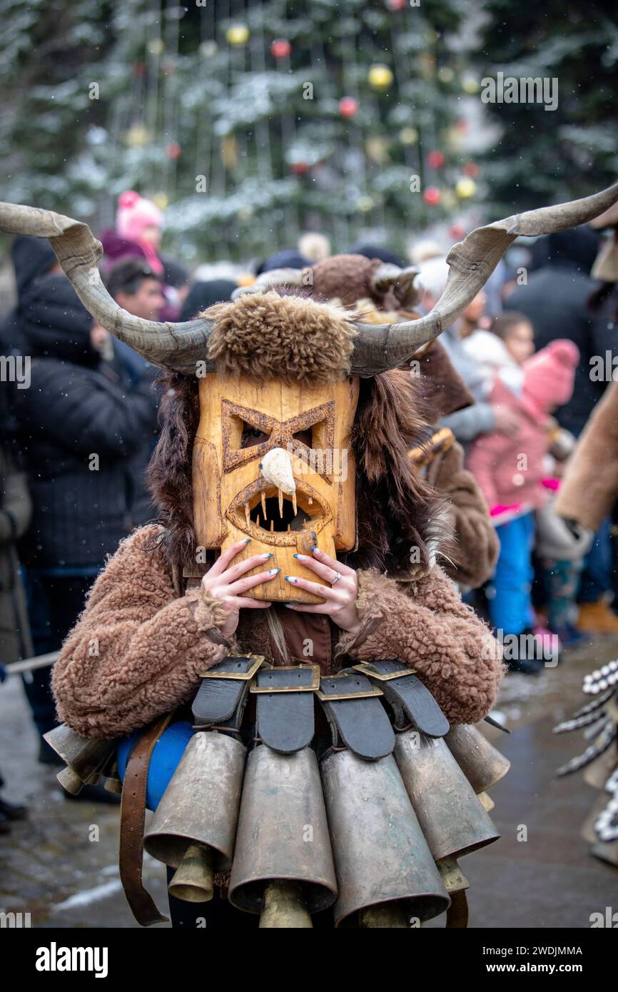 Breznik, Bulgaria - January 20, 2024: Masquerade festival in Breznik Bulgaria. People with a mask called Kukeri dance and perform to scare the evil sp Stock Photo